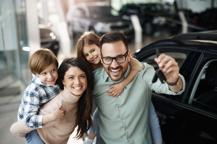 happy family buying new car for loan rates page