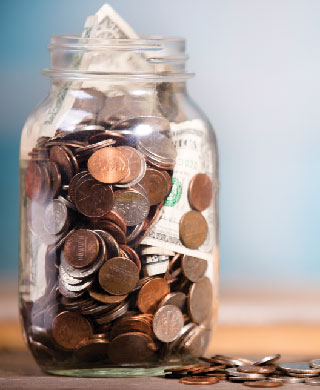 Jar with dollars and coins.